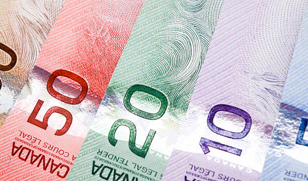 Loonie Steady as BoC Cuts as Expected, Fed Now in Spotlight